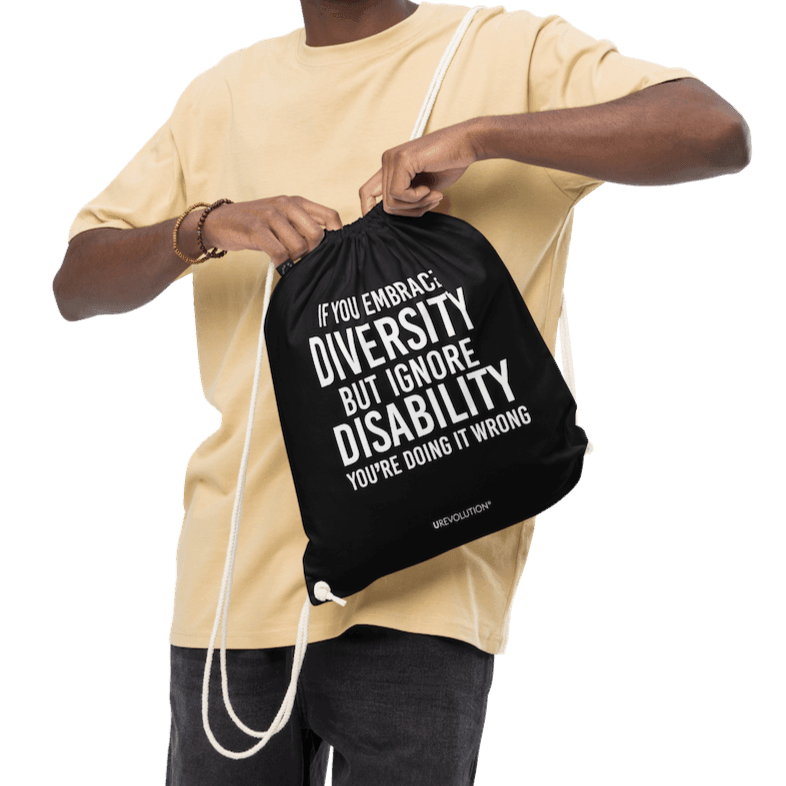 A black Embrace Diversity organic cotton drawstring bag. The middle of the drawstring bag features the phrase, printed in large white upper case letters, "If you embrace diversity but ignore disability, you're doing it wrong." The phrase fills 80% of the bag. 