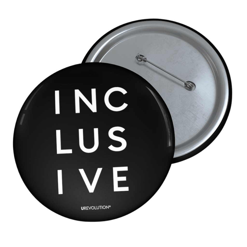 3" black inclusive pin button. On the front of the inclusive pin button is the word inclusive. The word inclusive is printed in black over three lines, with three letters on each line: INC LUS IVE. On the bottom edge of the pin, beneath the word inclusive, is the word URevolution in a small discrete font. horizontal black line.