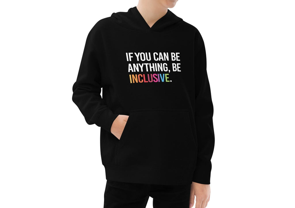 This is a photo of a black be inclusive kids hoodie. In the top one-third of kids hoodie, in white upper case letters, is the phrase: 'if you can be anything, be inclusive.' The word inclusive is in the colors of the rainbow.