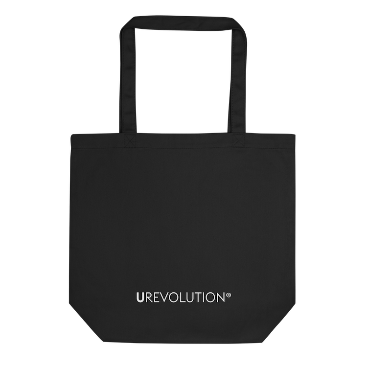 The back view of the Eco-friendly INCLUSIVE tote bag displayed flat, showcasing its spacious design and durable organic cotton fabric.