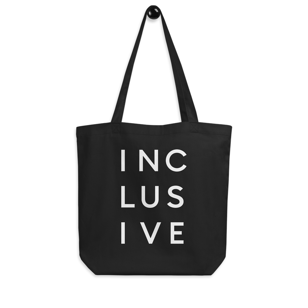 Eco-friendly INCLUSIVE tote bag displayed flat, showcasing its spacious design and durable organic cotton fabric.