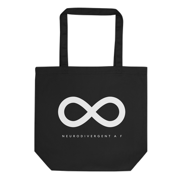 Black Organic Neurodivergent AF Tote. This is a photo of URevolution's organic Neurodiversity AF tote. In the middle of the tote bag, there is a white infinity symbol, the symbol of the neurodiversity movement. Under the symbol is the phrase, 'neurodivergent a f.'