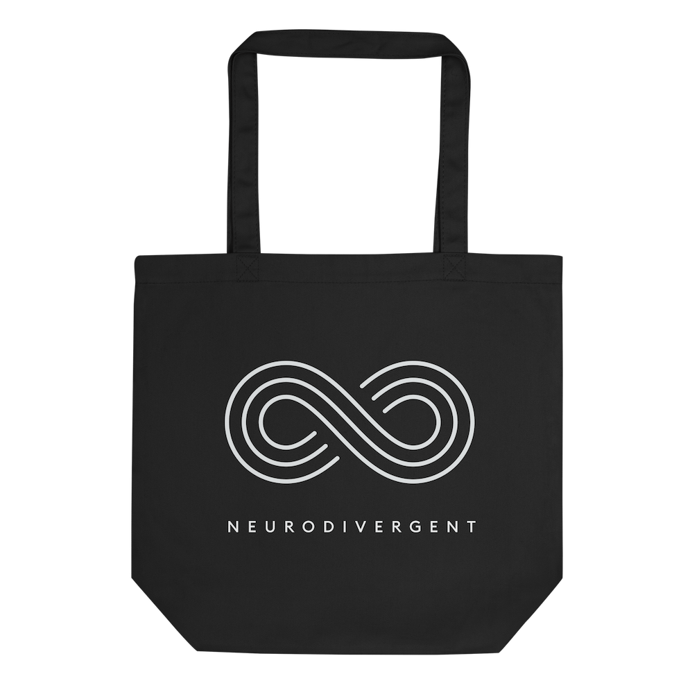 This is a photo of a black organic neurodivergent tote bag. In the middle of the tote is an elegant white infinity symbol consisting of three thin white lines. Just below the infinity symbol is the word Neurodivergent in elegant upper case white letters.