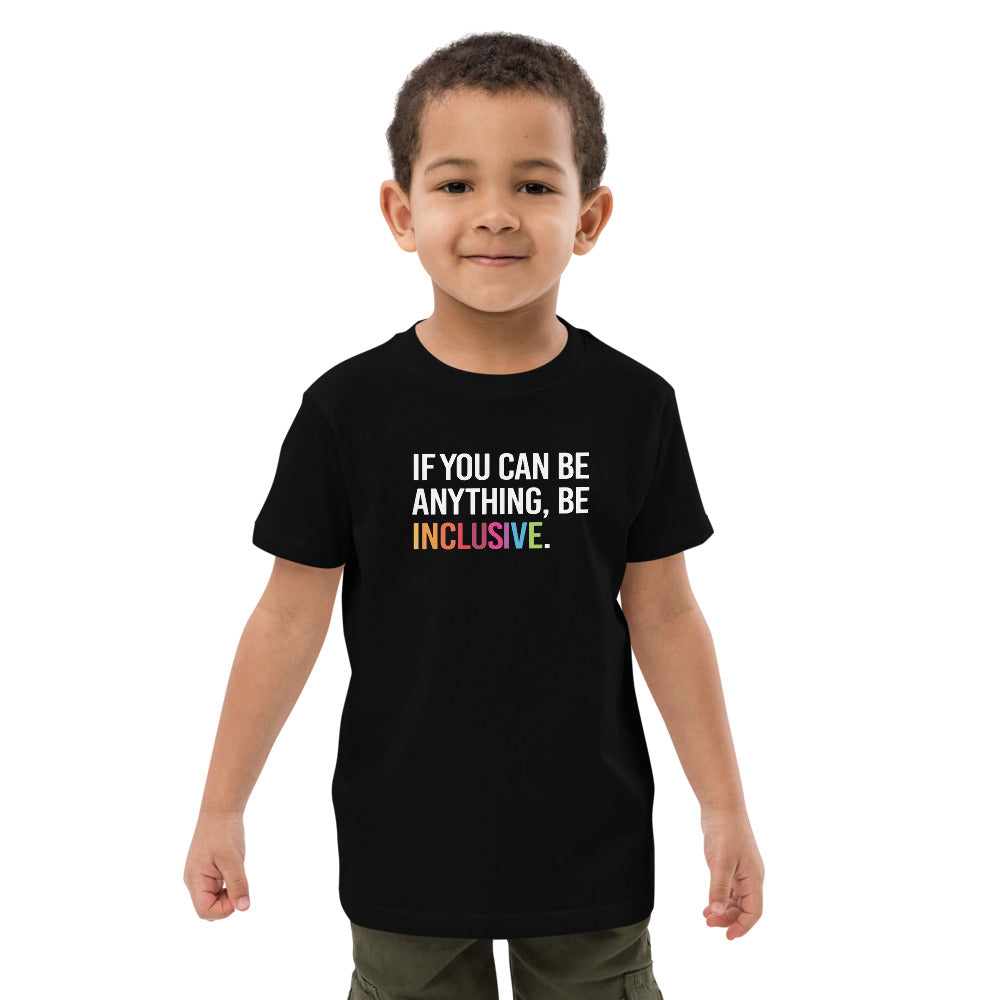This is a photo of a kids black premium organic Be Inclusive tee. On the front of the t-shirt, the phrase, 'If you can be anything, be inclusive,' is printed in white capital letters. The word INCLUSIVE is in the colors of the rainbow.