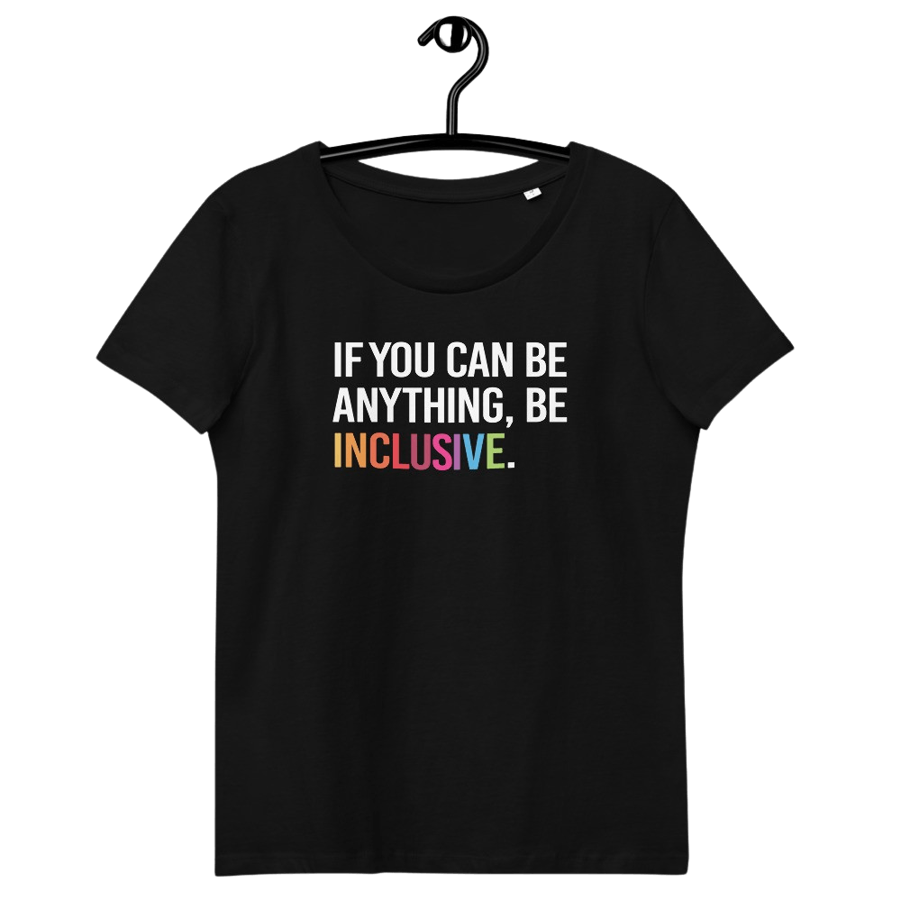 This is a photo of a black premium Be Inclusive fitted organic tee. On the front of the t-shirt, the phrase, 'If you can be anything, be inclusive,' is printed in white capital letters. The word INCLUSIVE is in the colors of the rainbow. The tee is on a black hanger.
