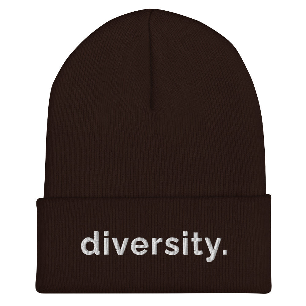 A brown diversity beanie has the word 'diversity' embroidered on the front cuff in white bold lower case letters.
