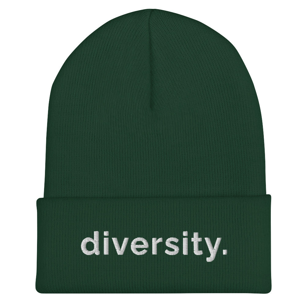 A spruce diversity beanie has the word 'diversity' embroidered on the front cuff in black bold lower case letters.