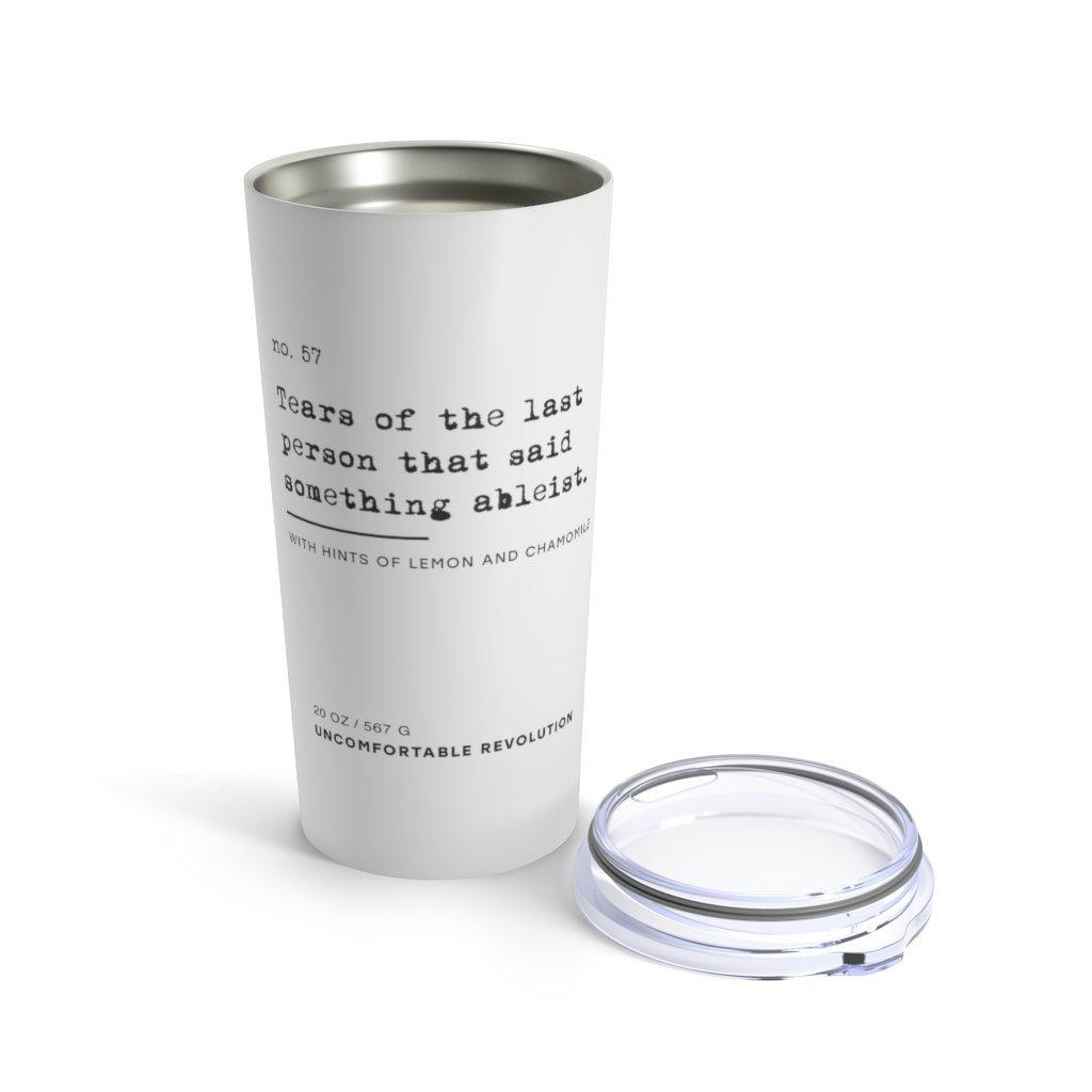 The ableist tears tumbler is white, with black text that reads: "no. 57. Tears of the last person that said something ableist. With hints of lemon and chamomile."