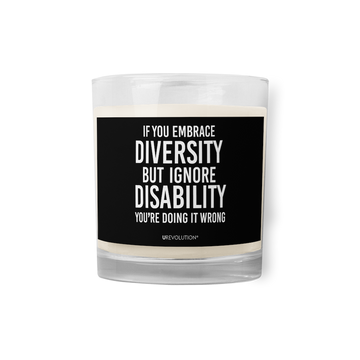 A Embrace Diversity wax candle with a black label. In the middle of the black label is the phrase, "If you embrace diversity but ignore disability you're doing it wrong."  The phrase is printed in white upper case letters.
