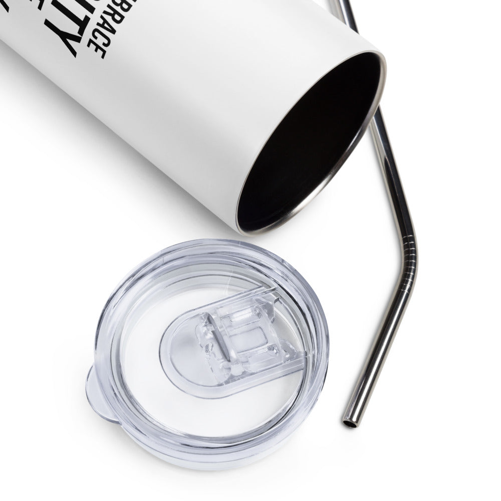 A 20 oz Embrace Diversity stainless steel travel mug. The mug has a stainless steel straw and plastic lid. In the middle of the mug is the phrase, printed in black upper case letters, 'If you embrace diversity, but ignore disability, you're doing it wrong.' The cylindrical mug has a plastic lid and stainless steel mug. 