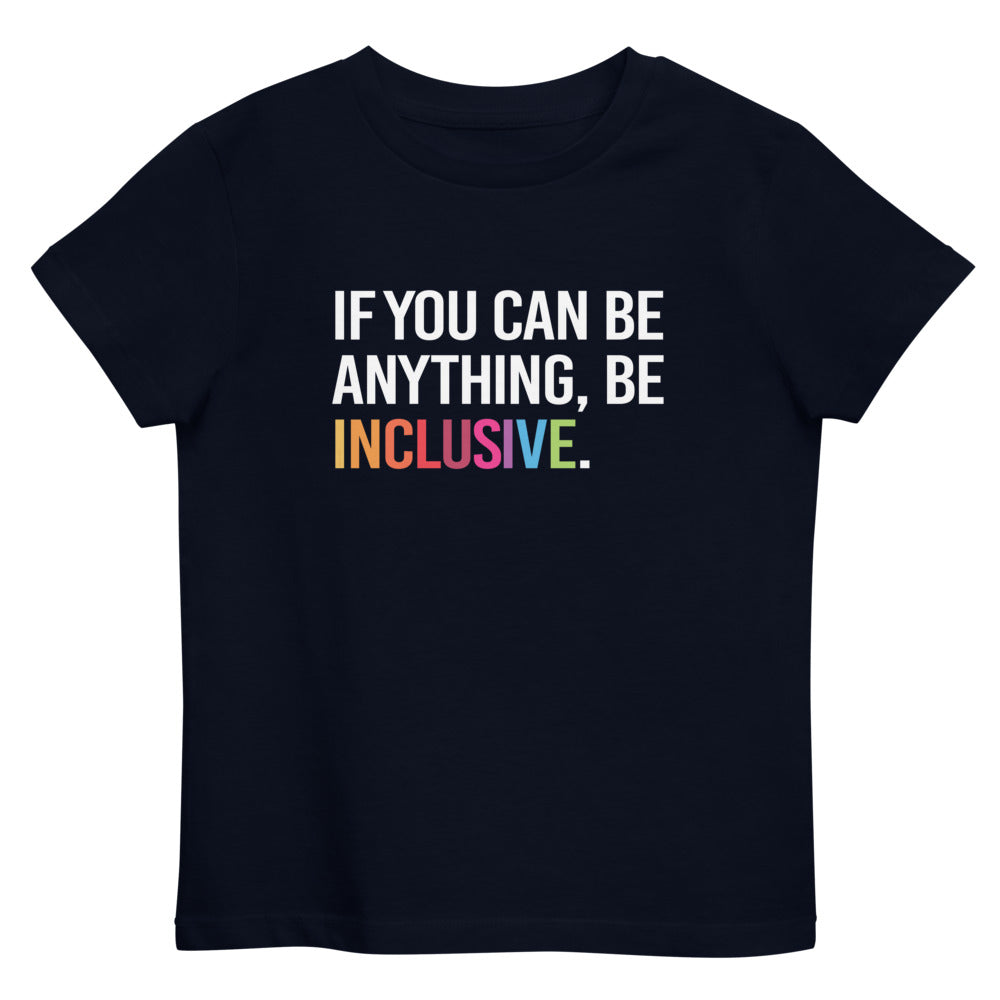 This is a photo of a kids navy premium organic Be Inclusive tee. On the front of the t-shirt, the phrase, 'If you can be anything, be inclusive,' is printed in white capital letters. The word INCLUSIVE is in the colors of the rainbow.