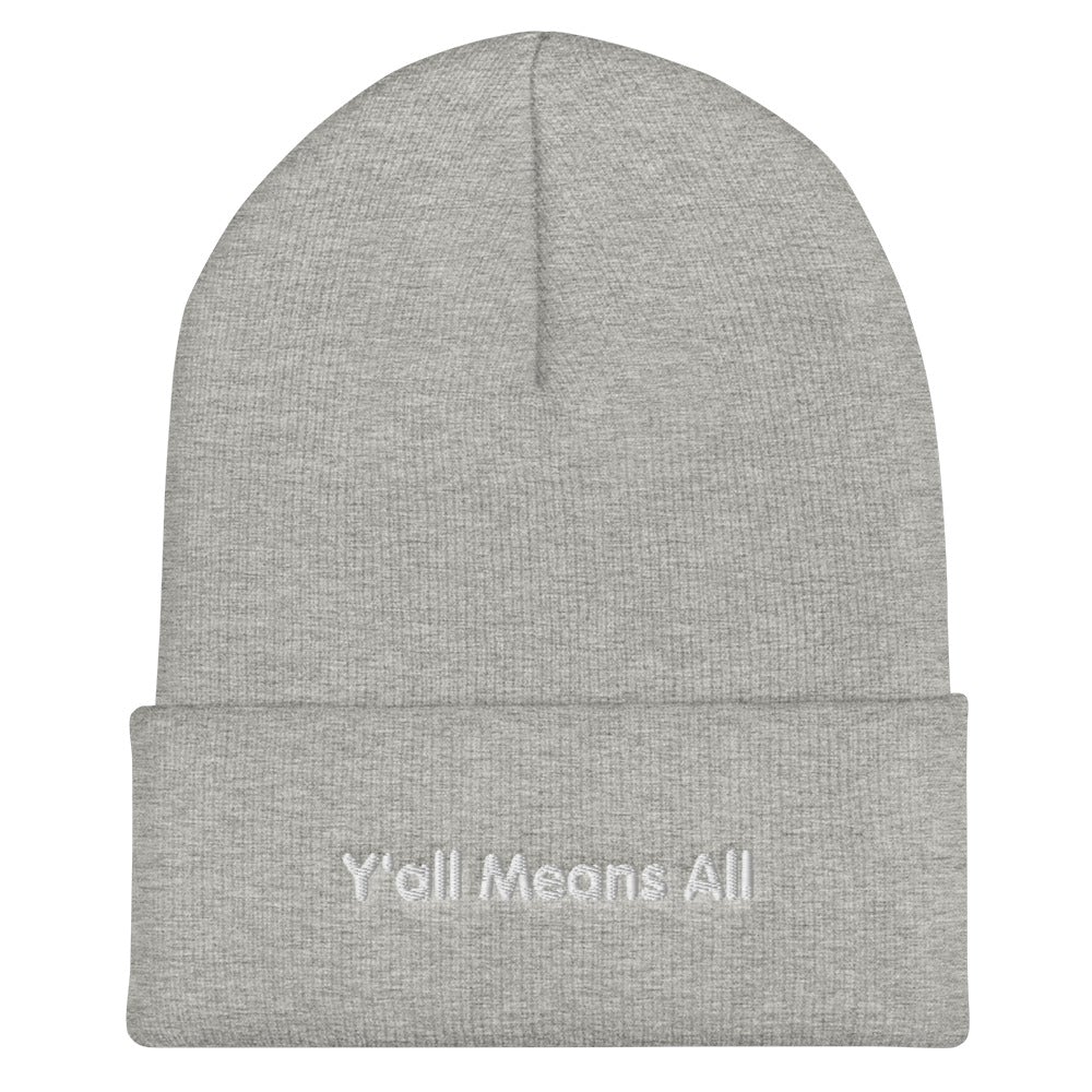 This is a photo of a heather-gray-colored Y'all Means All beanie. On the front of the beanie the phrase, 'Y'all Means All,' is embroidered on it in white title case letters