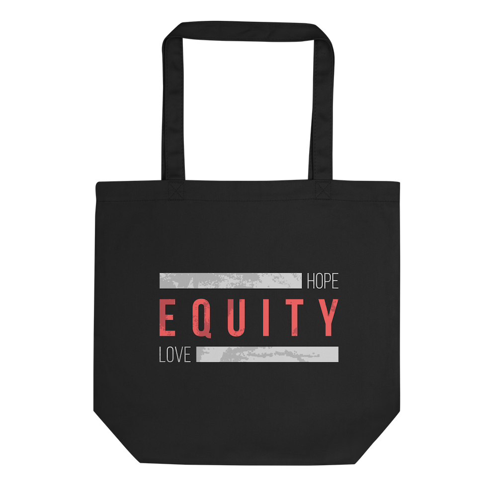 A black HELO Equity Organic Tote Bag. The word 'Equity' in upper case red letters is in the middle of the tote bag. Above and below the word are two thick distressed grey rectangle blocks with the word HOPE printed on the top right-hand side, and the word LOVE on the bottom right side of the block.