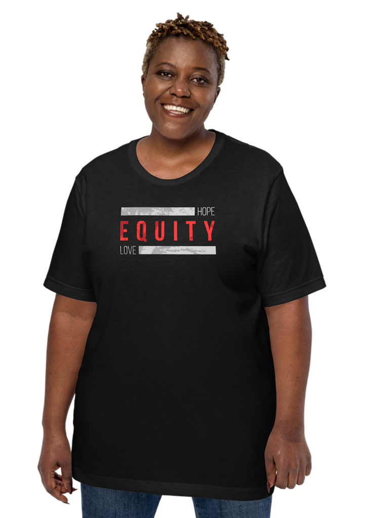 Equity t-shirt. In the middle top one-third of the equity t-shirt is the word 'Equity' in upper case red letters. Above and below the word are two thick rectangle blocks with a distressed pattern. The word HOPE is printed on the top right-hand side, and the word LOVE is on the bottom left side of the block. The tee is worn by a Black female model.