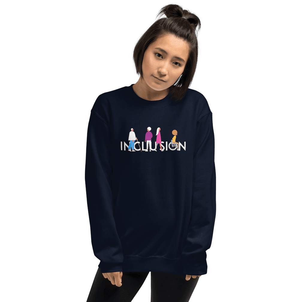 Navy disability inclusion sweatshirt featuring an original Inclusion icon: The word INCLUSION is written in white upper case letters. Among the letters are four characters: one larger person with glasses and a cane, one person with one arm wearing a turban, one person with long hair and a prosthetic leg, and one person with an afro, seated in a wheelchair leaning forward.. The disability inclusion sweatshirt is worn by a female model.