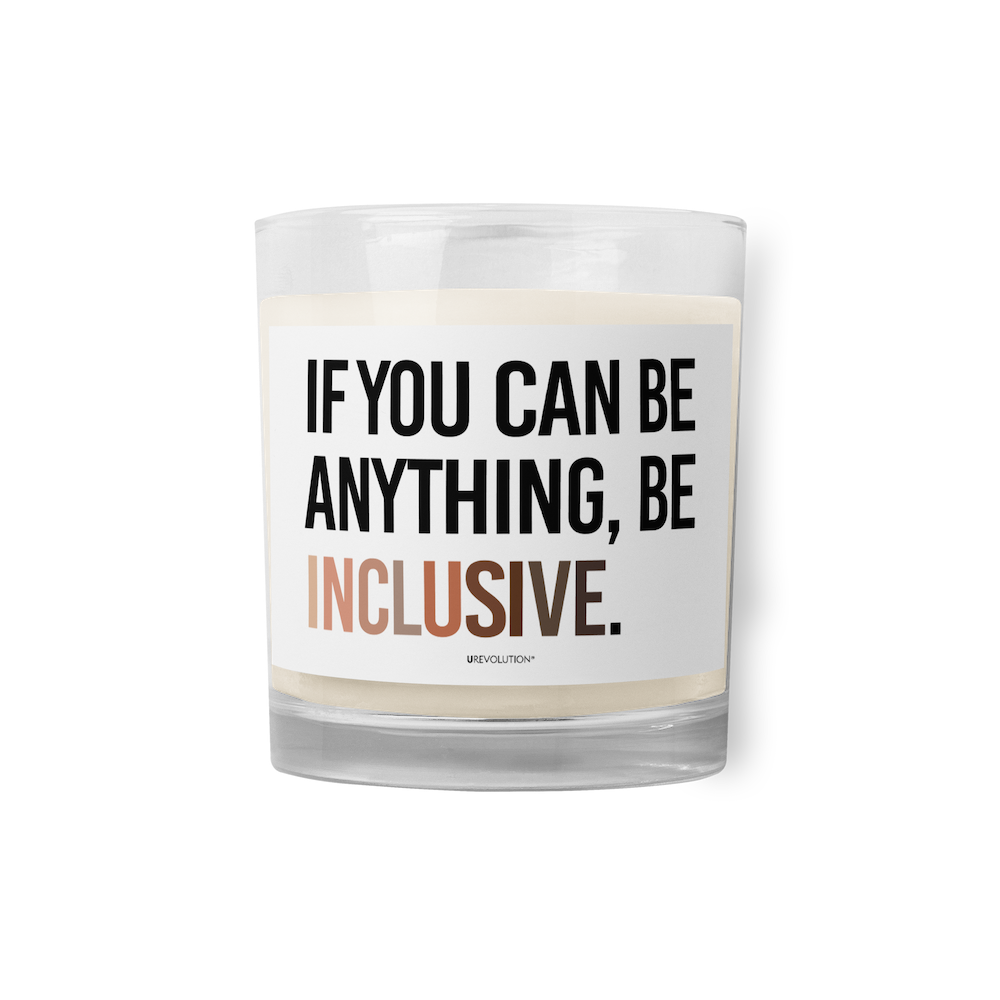 A Be Inclusive Diversity candle. On the front of the diversity candle is the phrase: "If you can be anything, be inclusive," in upper case letters printed on a white label. The text is all black, except the word "Inclusive," which is in different skin colors, with the lightest color on the left and the darkest on the right.