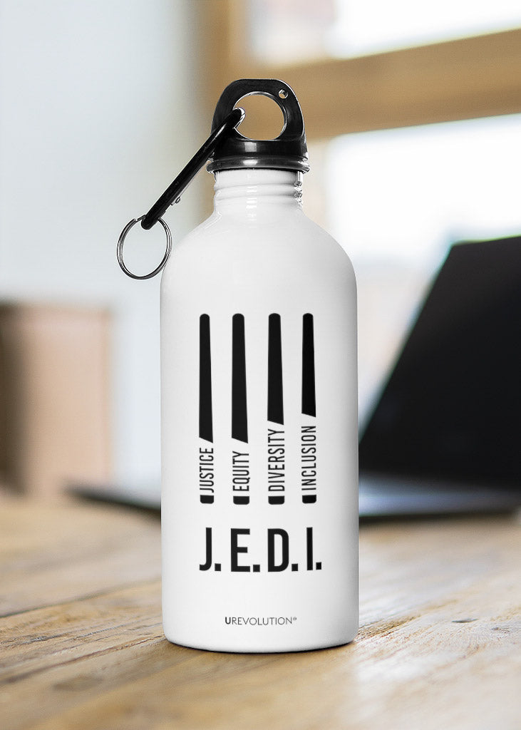 A justice equity diversity inclusion J.E.D.I water bottle with four stylized horizontal black laser swords. In each laser sword handle, one word is embedded: justice, equity, diversity, and inclusion in black upper case letters. The water bottle is shown on a wooden table.