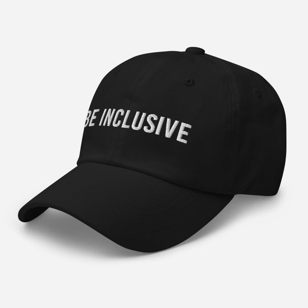 This is a photo of the front of a black cotton twill 'be inclusive cap,' with the phrase "Be Inclusive" embroidered on the front in upper case white letters.