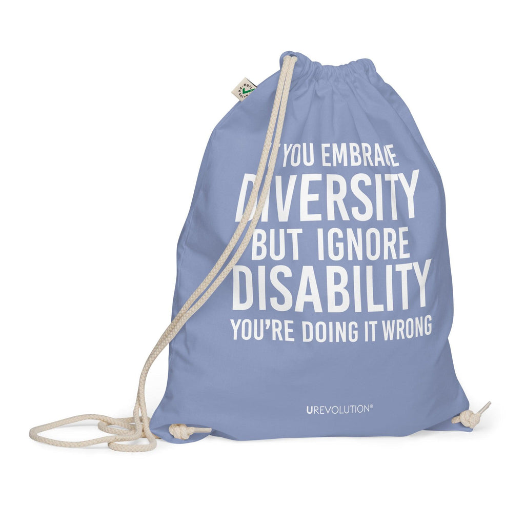 A light denim Embrace Diversity organic cotton drawstring bag. The middle of the drawstring bag features the phrase, printed in large white upper case letters, "If you embrace diversity but ignore disability, you're doing it wrong." The phrase fills 80% of the bag. 