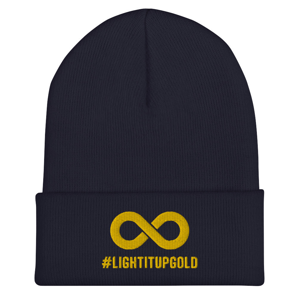 Light it up gold beanie. A thick bold gold infinity symbol is in the middle of a navy beanie. Directly under the symbol in upper case letters is the word #LIGHTITUPGOLD