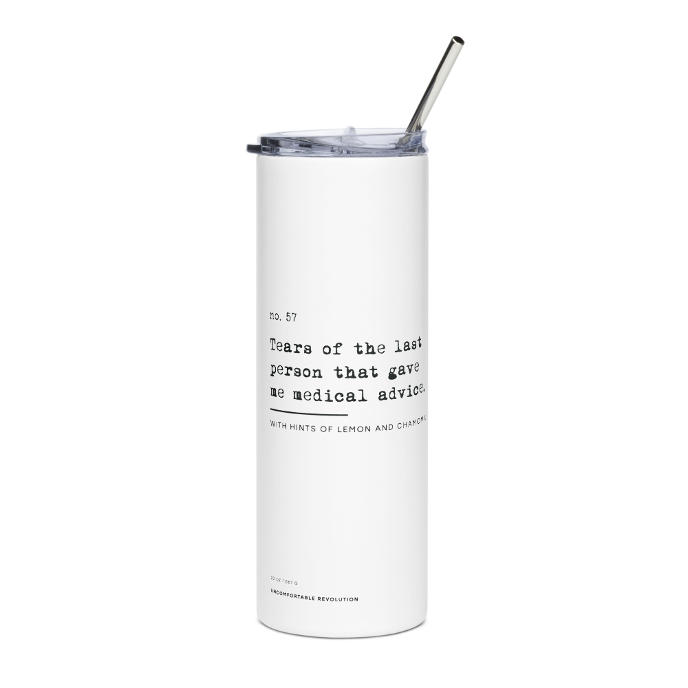 The Medical Advice Stainless Steel Travel Mug is white, with black text printed in the middle of the mug's exterior: "no. 57. Tears of the last person that gave me medical advice. With hints of lemon and chamomile." At the base of the mug is the text: 20oz / 567 gr Uncomfortable Revolution. The mug has plastic lid and metal straw.