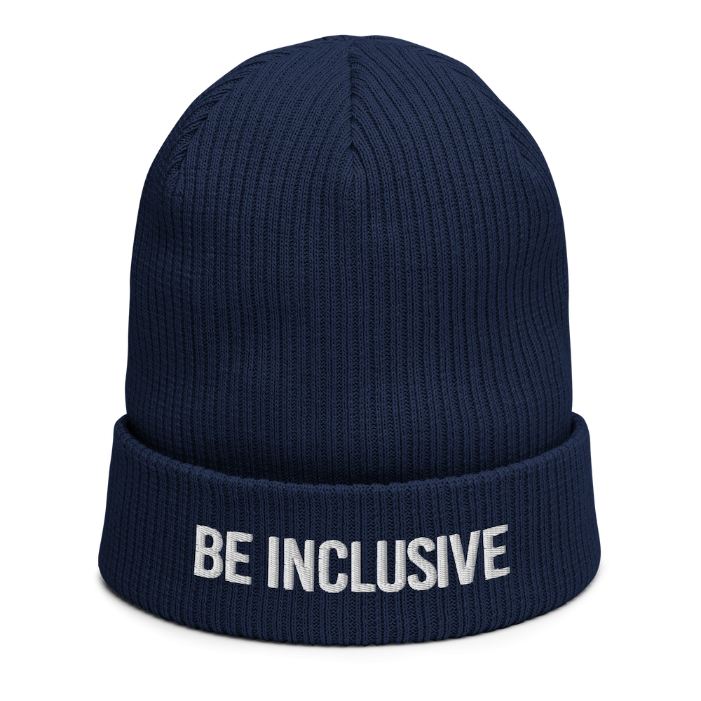 This is a photo of a navy Be Inclusive organic beanie. The words 'Be Inclusive' are embroidered on the front of the beanie in white upper case letters.