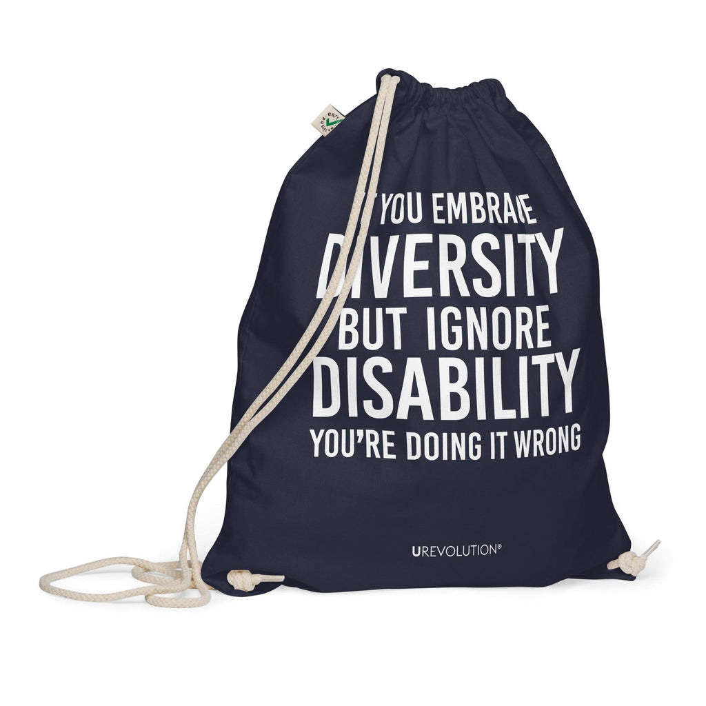 A navy Embrace Diversity organic cotton drawstring bag. The middle of the drawstring bag features the phrase, printed in large white upper case letters, "If you embrace diversity but ignore disability, you're doing it wrong." The phrase fills 80% of the bag. 