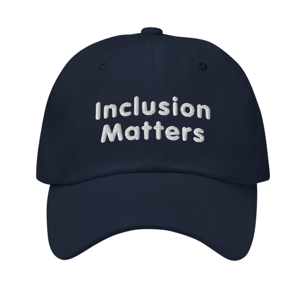 This is a photo of a navy Inclusion Matters Baseball Cap. On the front of the baseball cap above the visor are two words, 'Inclusion Matters.' printed in white sentence case letters over two lines.