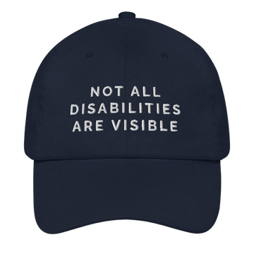 A navy 'Not All Disabilities Are Visible' cap. In the middle of the cap is the phrase, 'Not All Disabilities Are Visible,' embroidered in white upper case letters.
