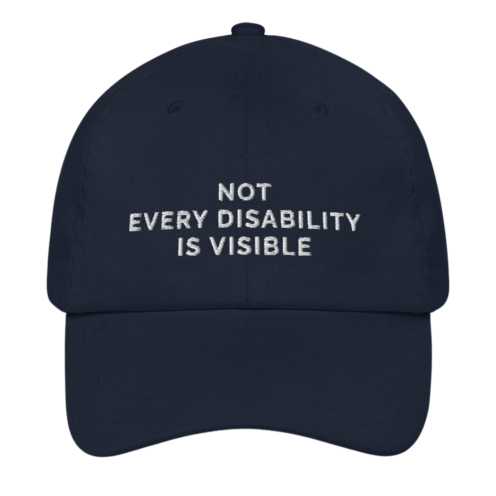 This is a photo of a navy 'not every disability is visible' cap. Embroidered, on the front of the cap in white upper case letters, is the phrase 'Not Every Disability Is Visible.'