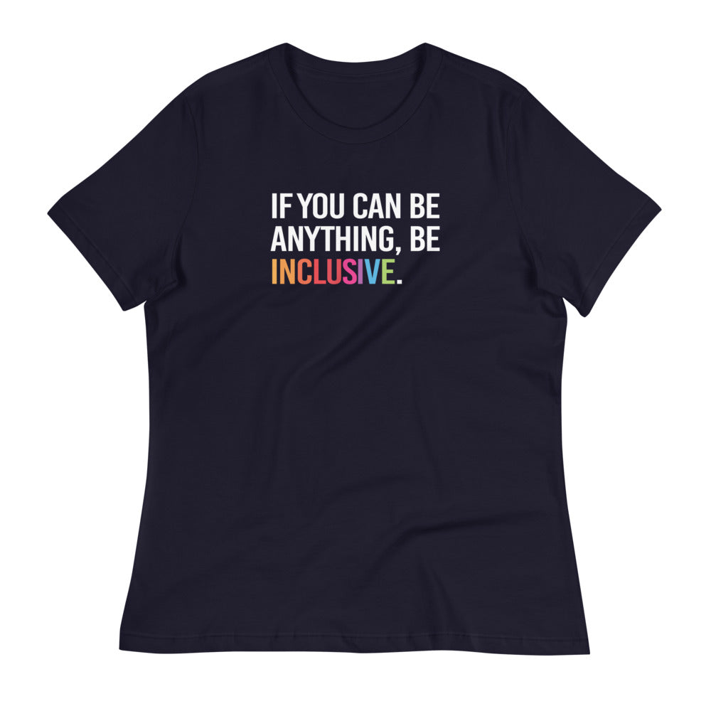 This is a photo of a navy relaxed-cut Be Inclusive Tee Be against a plain background. On the front of the t-shirt, the phrase, 'If you can be anything, be inclusive,' is printed in white capital letters.   The word "Inclusive" is in rainbow colors.