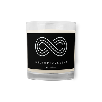 Neurodivergent candle by URevolution. This is a photo of a candle in a glass jar with a black label. In the middle of the black label is a three-ringed infinity symbol with the word 'neurodivergent' in white upper case letters beneath the symbol. 