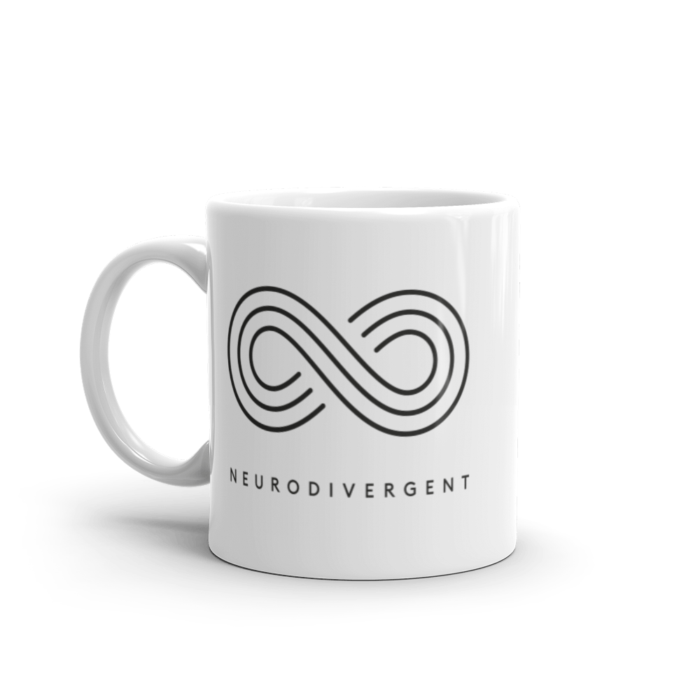 White 11oz Neurodivergent Mug . In the middle of the tee is an elegant black infinity symbol consisting of three thin black lines. Just below the infinity symbol is the word Neurodivergent in elegant upper case black letters.
