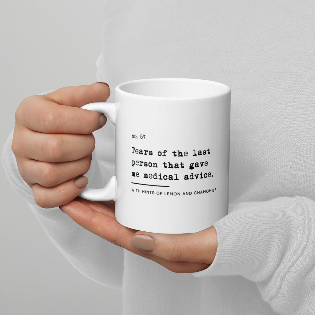 The no medical advice mug is white, with black text that reads: "no. 57. Tears of the last person that gave me medical advice. With hints of lemon and chamomile." 