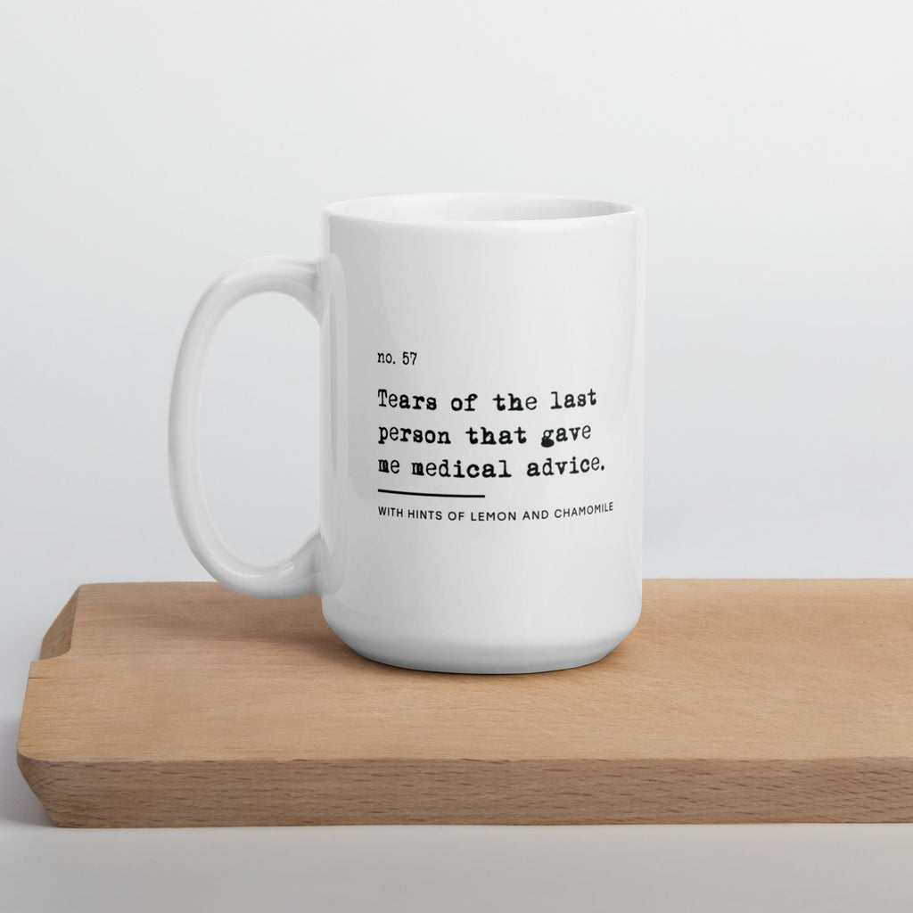 The no medical advice mug is white, with black text that reads: "no. 57. Tears of the last person that gave me medical advice. With hints of lemon and chamomile." 