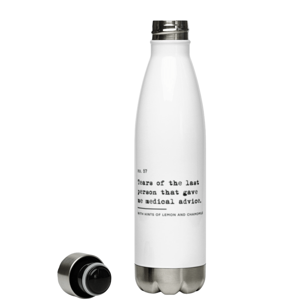 The no medical advice water bottle is white, shaped like a bowling pib, with black text that reads: "no. 57. Tears of the last person that gave me medical advice. With hints of lemon and chamomile." The bottle is shaped like a bowling pin with the lid off.