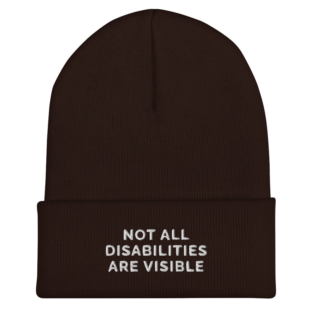 A brown Not All Disabilities Are Visible Beanie. The phrase, "Not All Disabilities Are Visible," is embroidered on the front of the beanie.