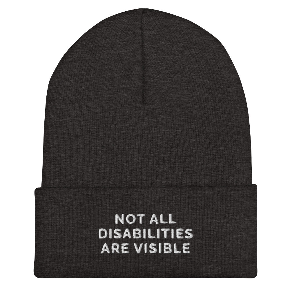 A dark grey Not All Disabilities Are Visible Beanie. The phrase, "Not All Disabilities Are Visible," is embroidered on the front of the beanie.