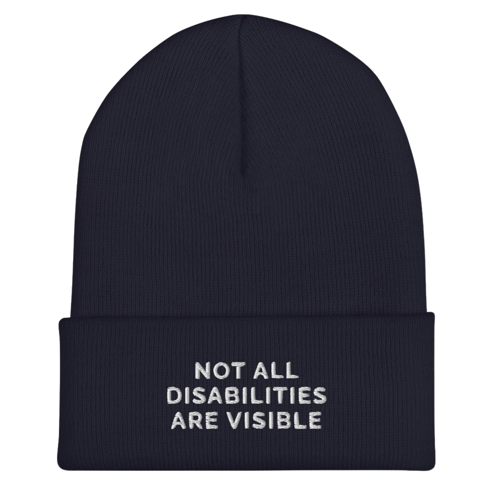 A navy Not All Disabilities Are Visible Beanie. The phrase, "Not All Disabilities Are Visible," is embroidered on the front of the beanie.