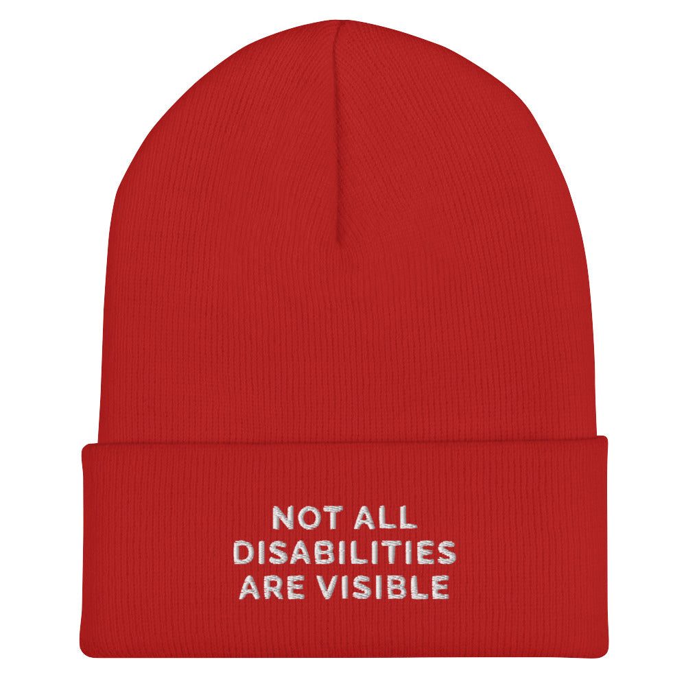 A red Not All Disabilities Are Visible Beanie. The phrase, "Not All Disabilities Are Visible," is embroidered on the front of the beanie.