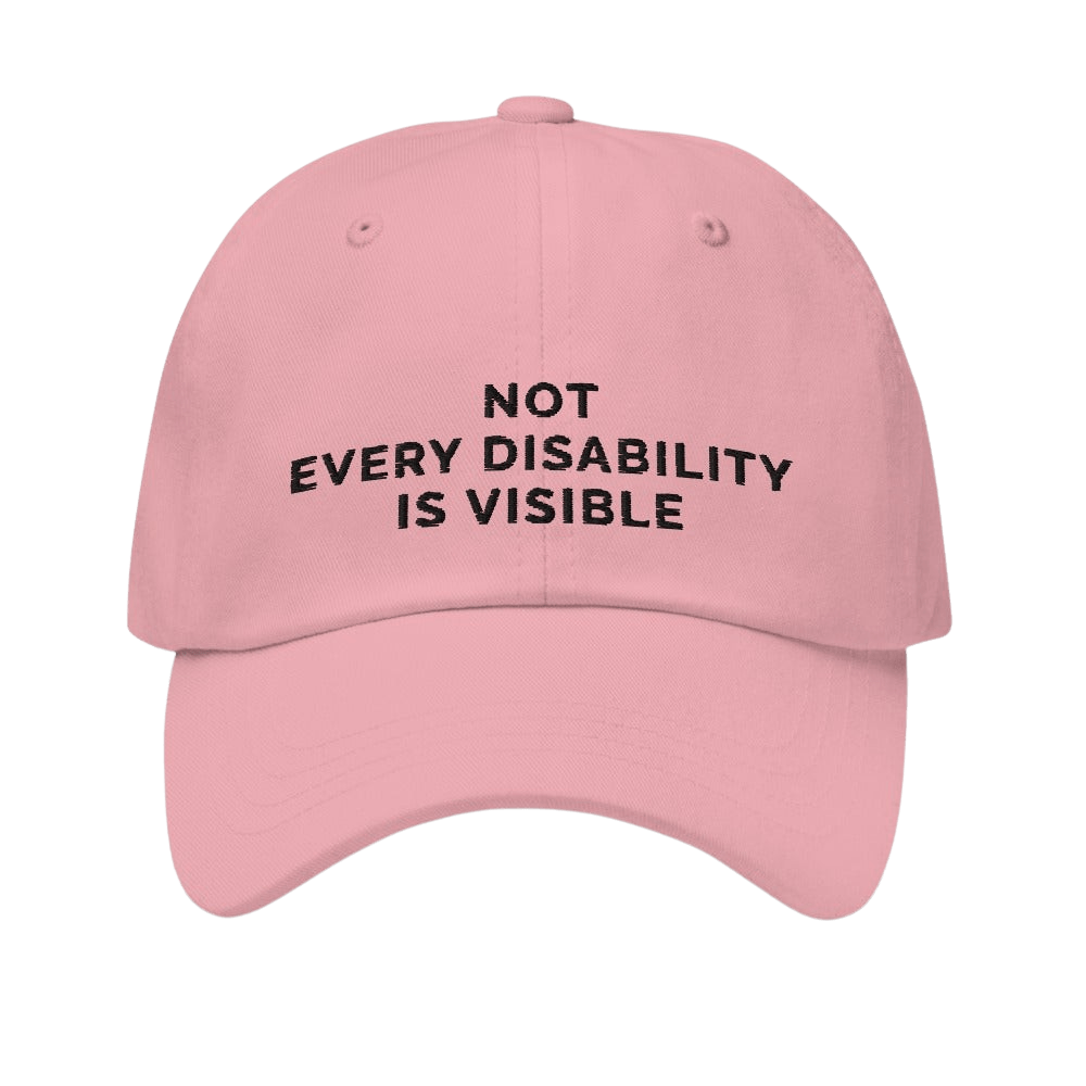 This is a photo of a pink 'not every disability is visible' cap. Embroidered, on the front of the cap in black upper case letters, is the phrase 'Not Every Disability Is Visible.'