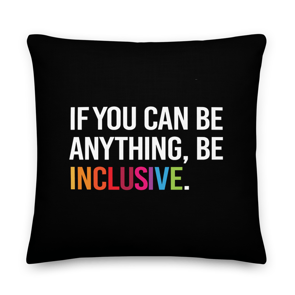 This is an image of a black premium Be Inclusive throw cushion. In the middle of the square throw cushion, the following phrase is printed in white upper case letters, "IF YOU CAN BE ANYTHING, BE INCLUSIVE." The word INCLUSIVE is in rainbow-like colors. 