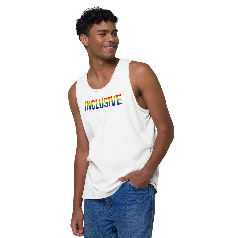 Photo of a white premium inclusive pride tank top. In the middle top 1/3 of the tank top is the word "Inclusive." The word is written in blended upper case rainbow pride colors:  red, orange, yellow, green, indigo, and violet.  