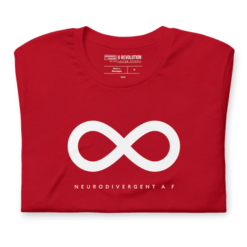 Red Neurodivergent AF Shirt. In the top third of the Neurodivergent AF tee, there is a white infinity symbol. Under the symbol is the phrase, 'Neurodivergent AF,' in white upper case letters. The tee is folded in half.