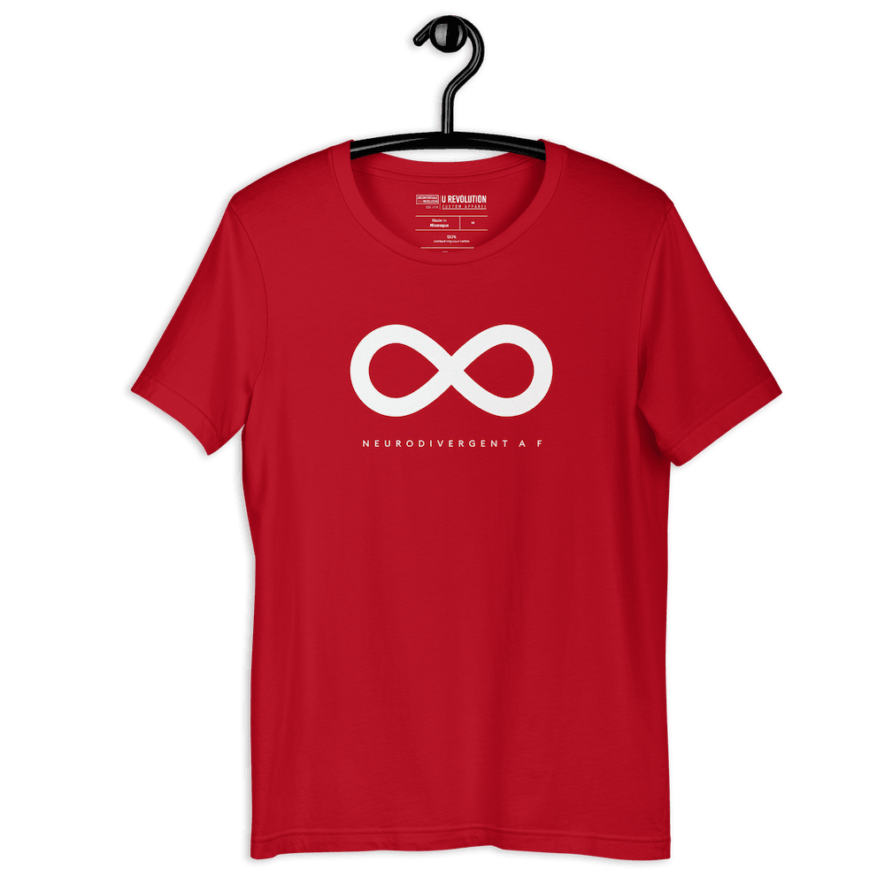 Red Neurodivergent AF Shirt. In the top third of the Neurodivergent AF tee, there is a white infinity symbol. Under the symbol is the phrase, 'Neurodivergent AF,' in white upper case letters. The tee is hanging on a black hanger against a blank background.