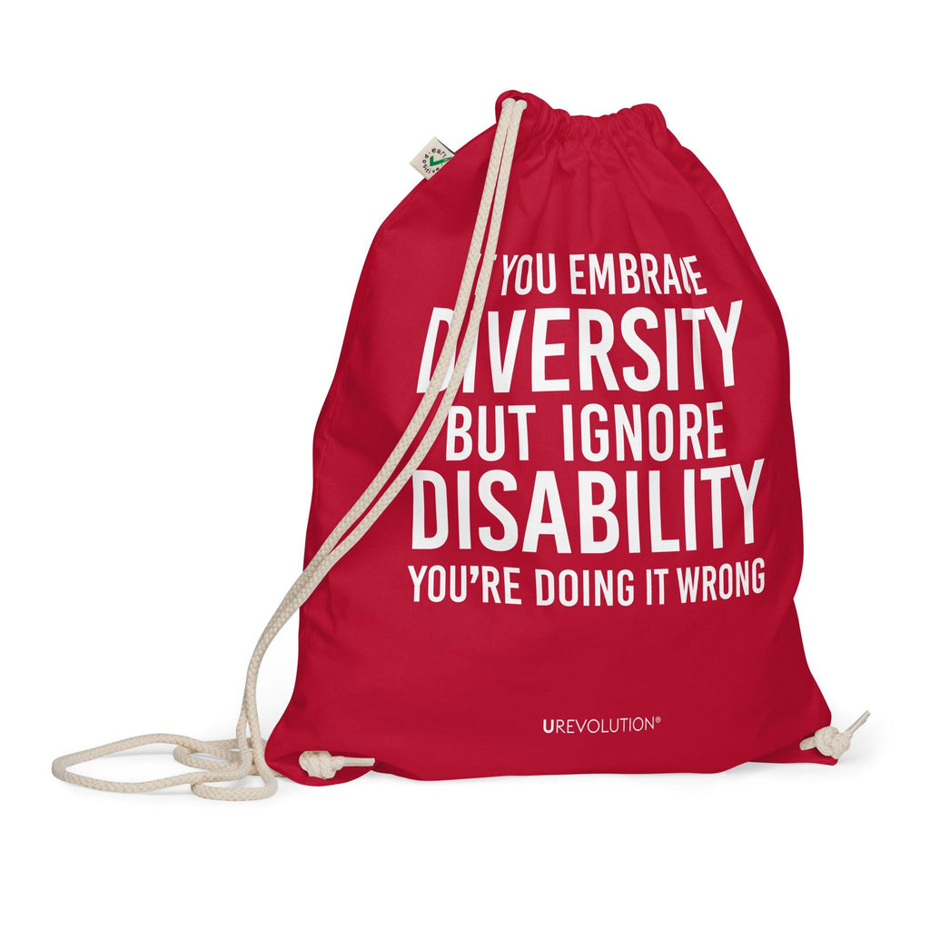 A red Embrace Diversity organic cotton drawstring bag. The middle of the drawstring bag features the phrase, printed in large white upper case letters, "If you embrace diversity but ignore disability, you're doing it wrong." The phrase fills 80% of the bag. 