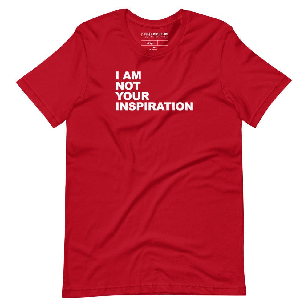 This is a red 'I Am Not Your Inspiration" t-shirt. On the top third of the inspiration shirt is the phrase, "I am not your inspiration," printed over four lines in white upper case letters.