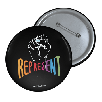 Represent pin button. In the middle of the pin is a white drawing of a raised clenched fist, with the handwritten word “represent,” written in upper case rainbow colors.