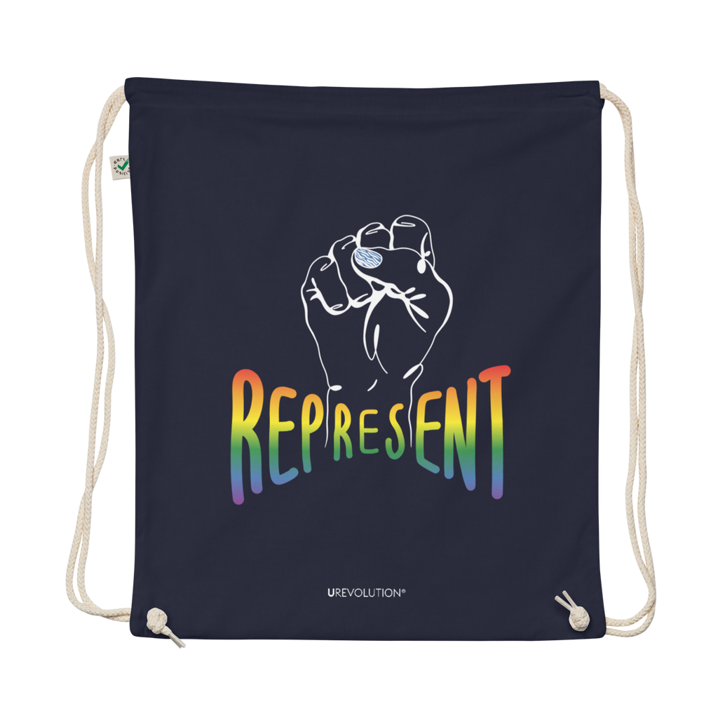 Photo of a navy organic Represent Pride drawstring bag. In the middle of the represent pride bag is a white line drawing of a raised clenched fist, with the handwritten word "represent," written in blended upper case rainbow pride colors:  red, orange, yellow, green, indigo, and violet. Under the fist, at the bottom of the magnet, is the word URevolution in small black upper case letters.