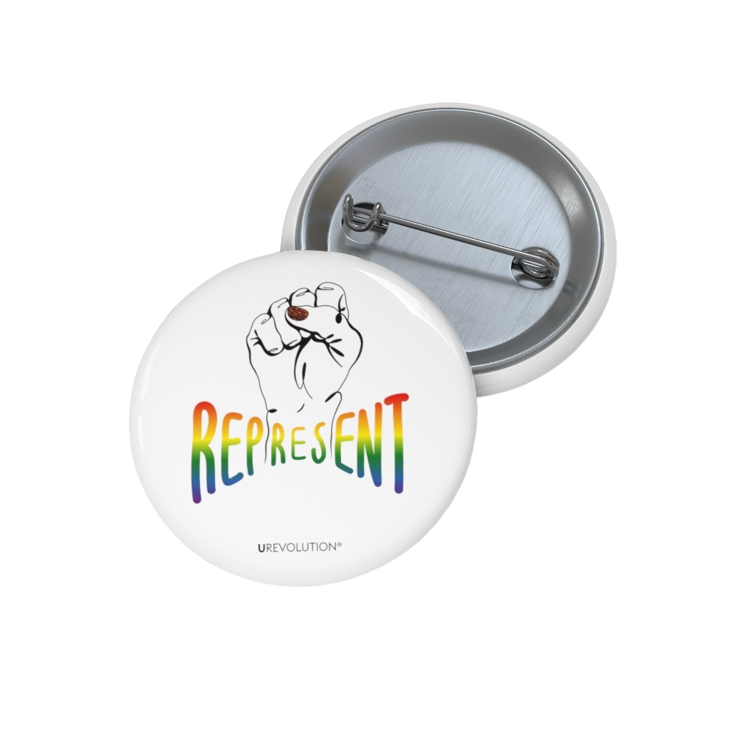 Represent Pride Pin Button. In the middle of the represent pride pinback button is a black line drawing of a raised clenched fist, with the handwritten word "represent," written in blended upper case rainbow pride colors: red, orange, yellow, green, indigo, and violet. Under the fist, at the bottom of the magnet, is the word URevolution in small black upper case letters.